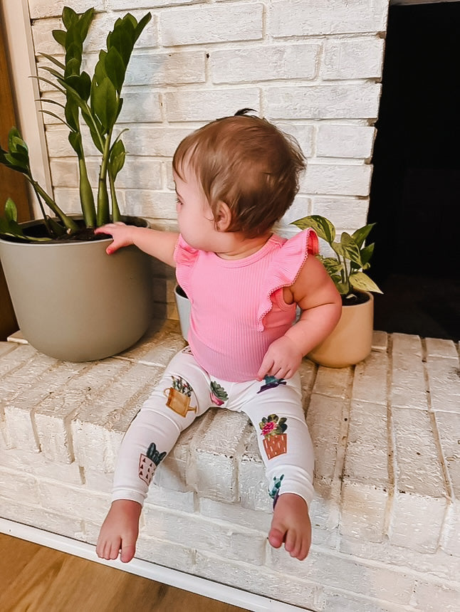 Trendy baby and toddler leggings featuring a cute watercolor cactus and succulent print.