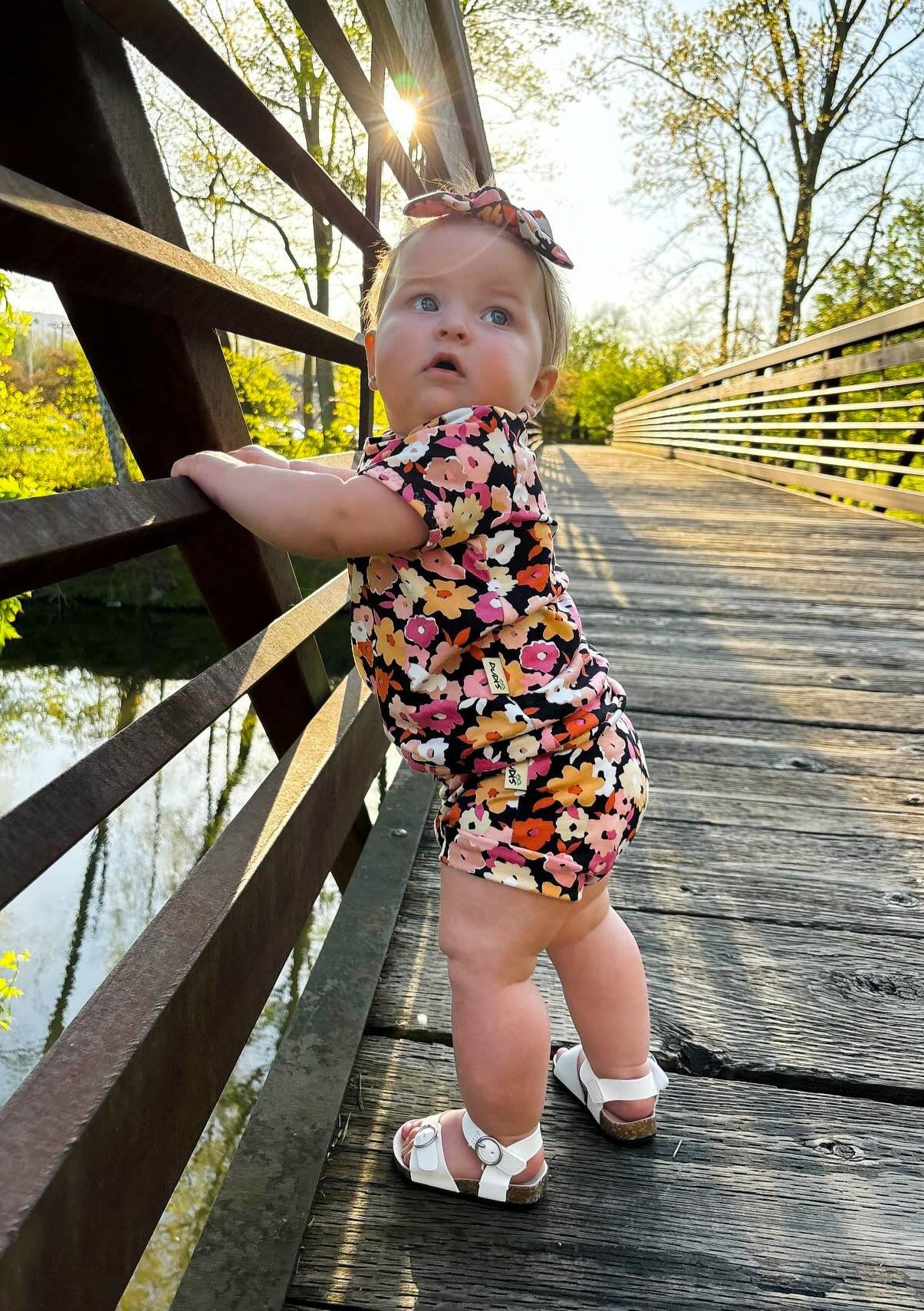 Baby Girl wearing Poppies on Black Summer Lounge Set