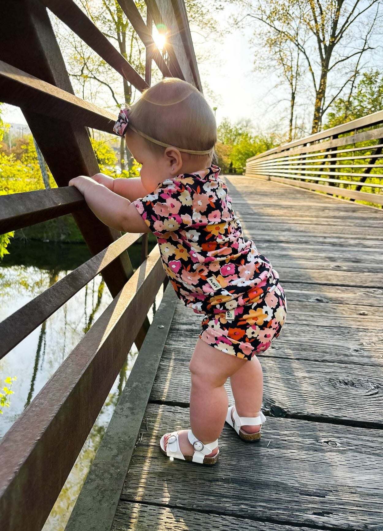 Baby Girl wearing Poppies on Black Summer Lounge Set