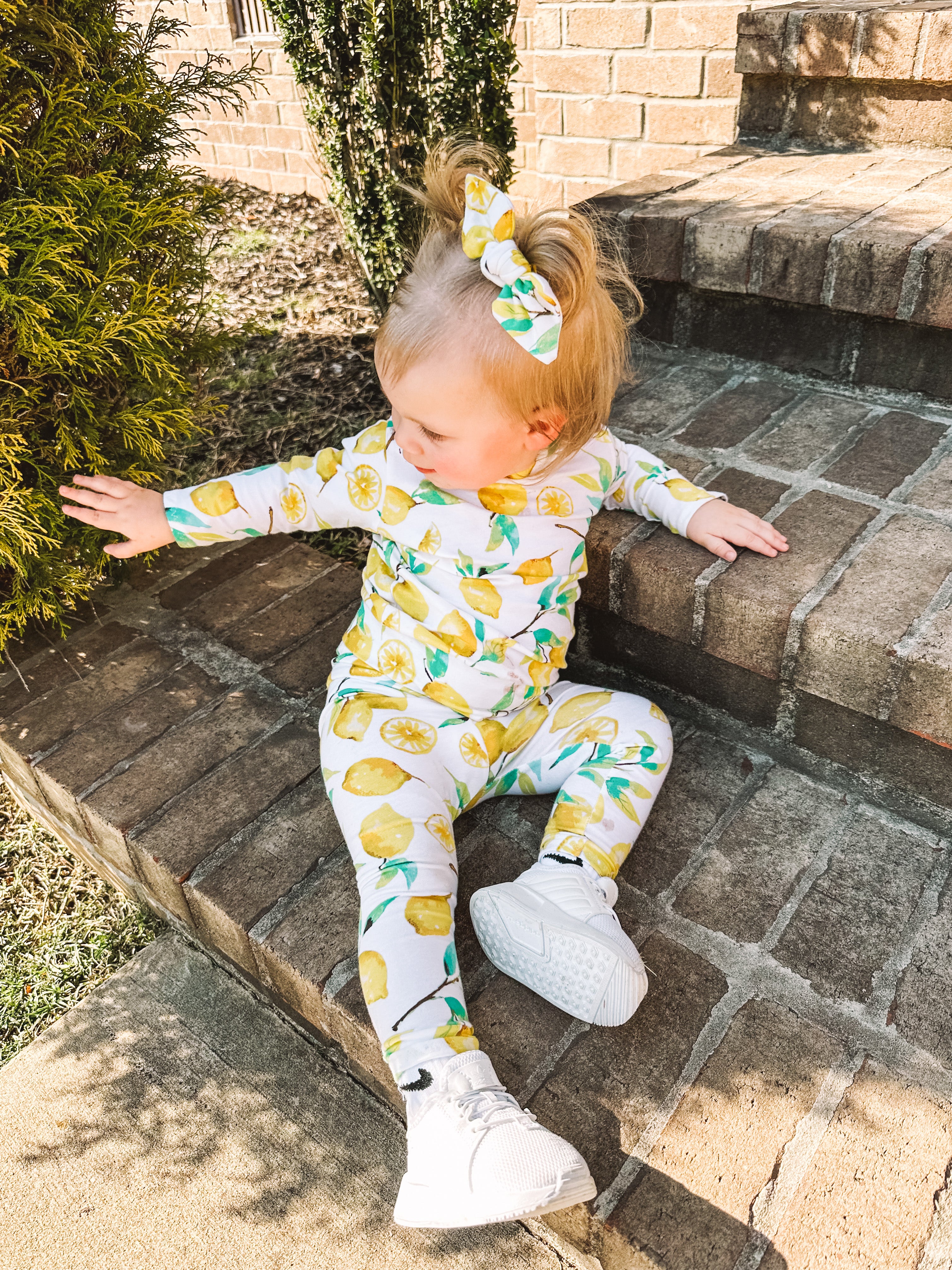 Baby Girl wearing Lemons on White Lounge Set