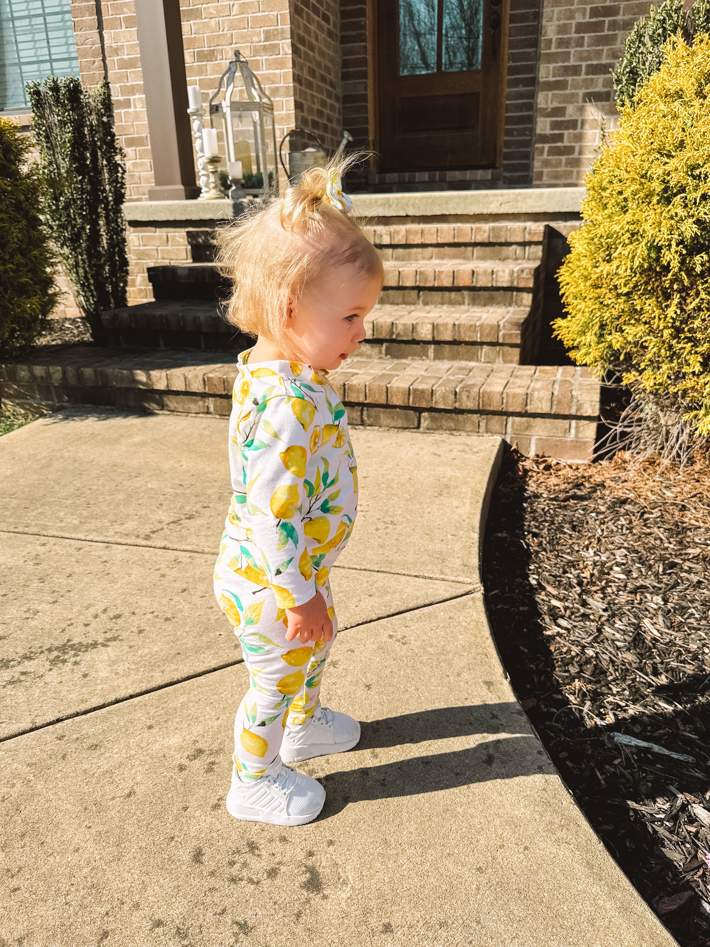 Baby Girl wearing Lemons on White Lounge Set