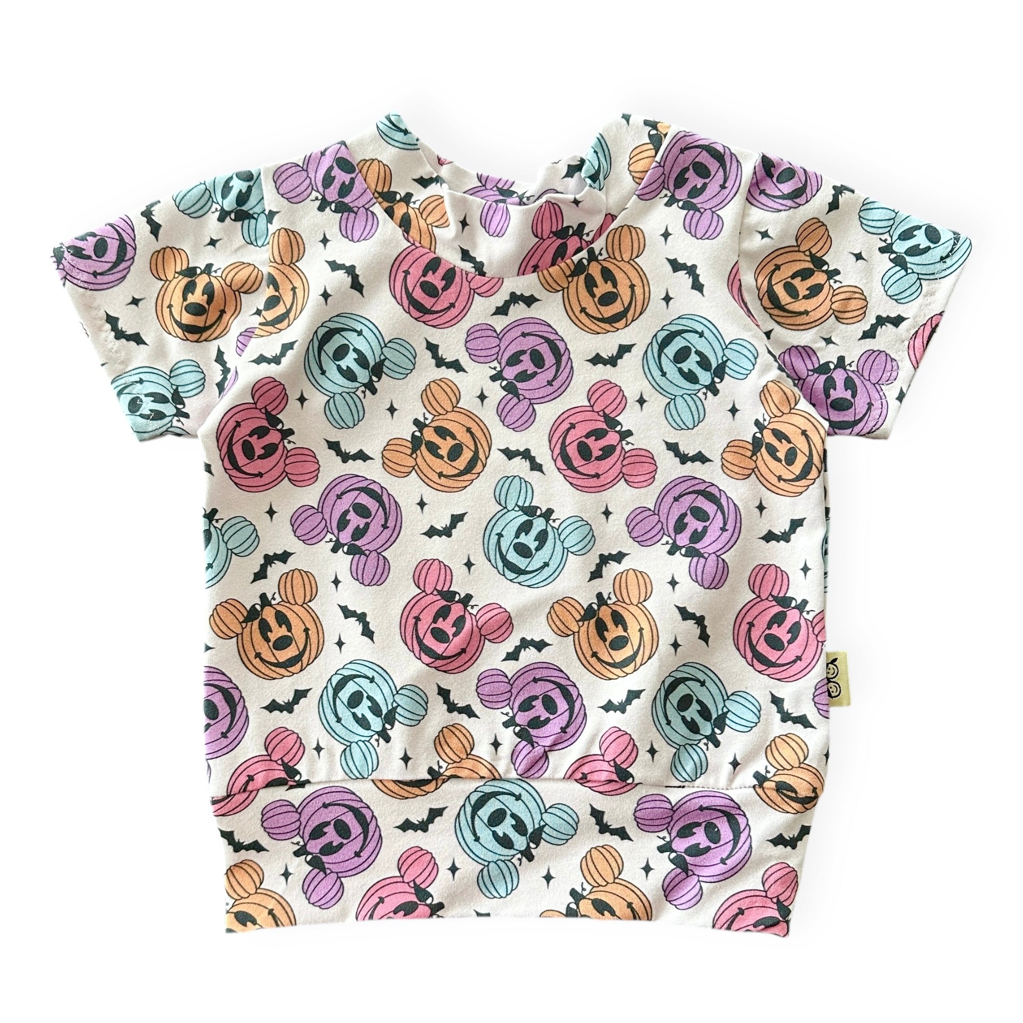 Baby t-shirt with Halloween-themed pattern on a white background