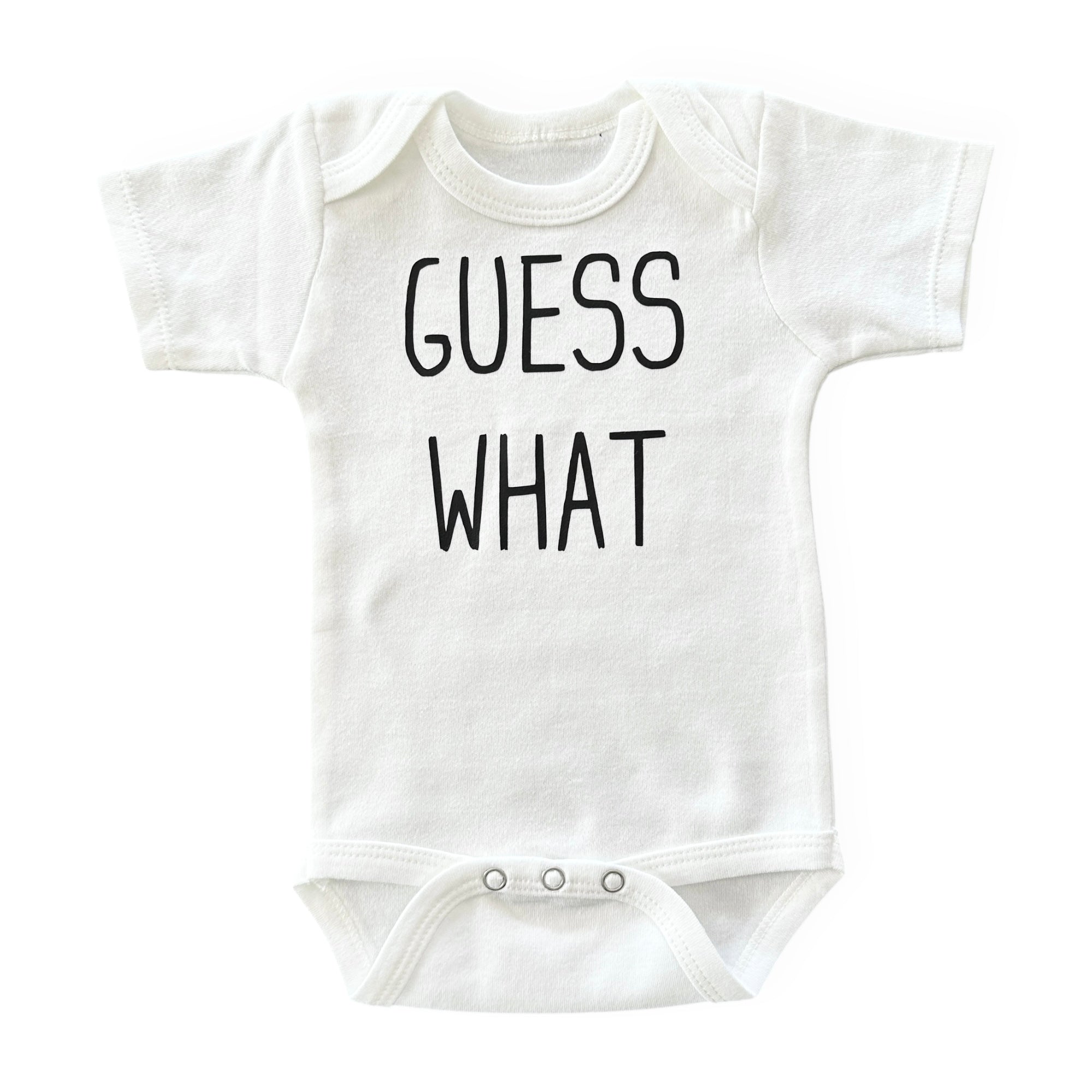 White baby bodysuit with "Guess What?" text – soft, breathable, and perfect for newborn photoshoots.