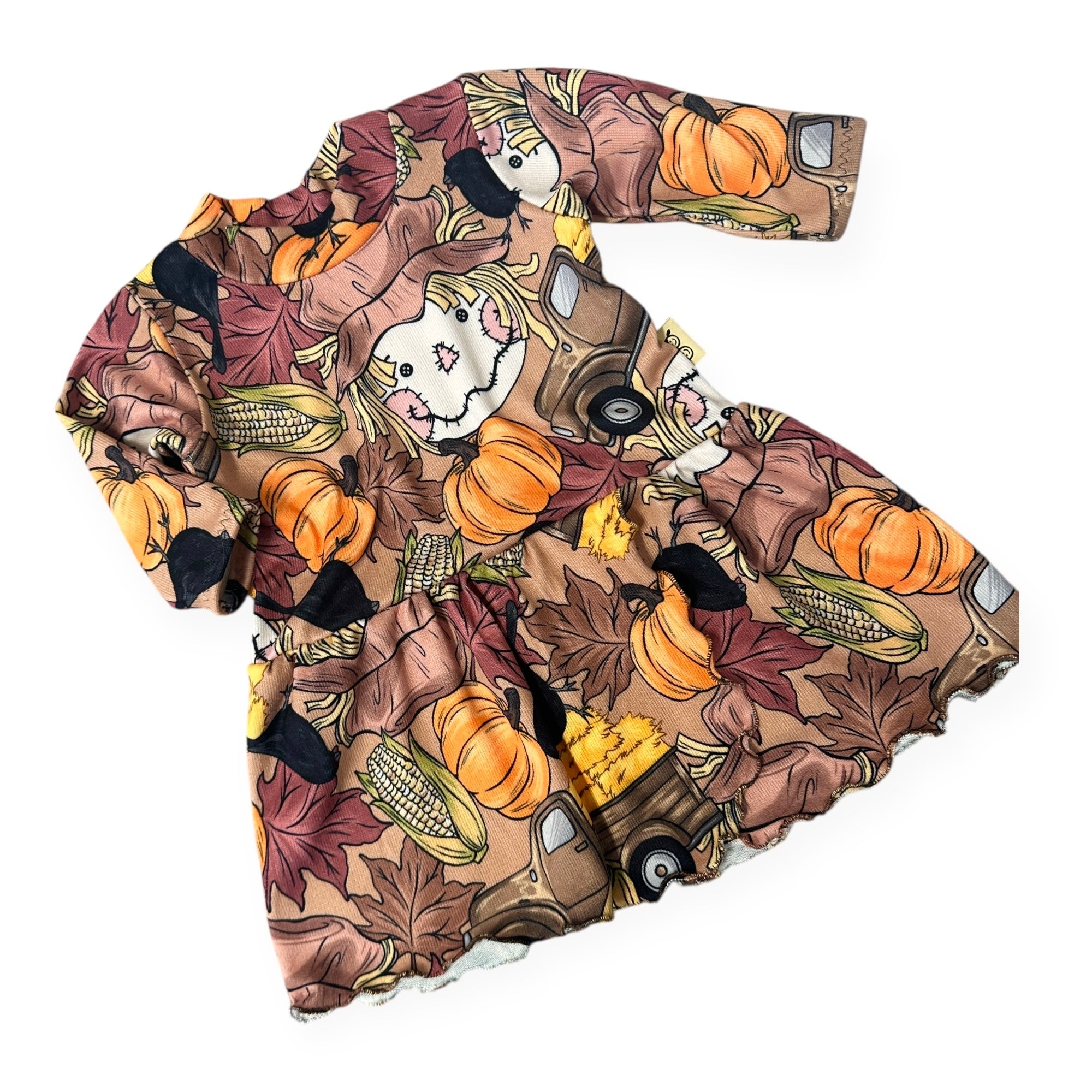 Handmade baby and toddler fall dress with scarecrow, pumpkins, corn, and autumn leaves pattern – Harvest Scarecrow print by Dudis Design