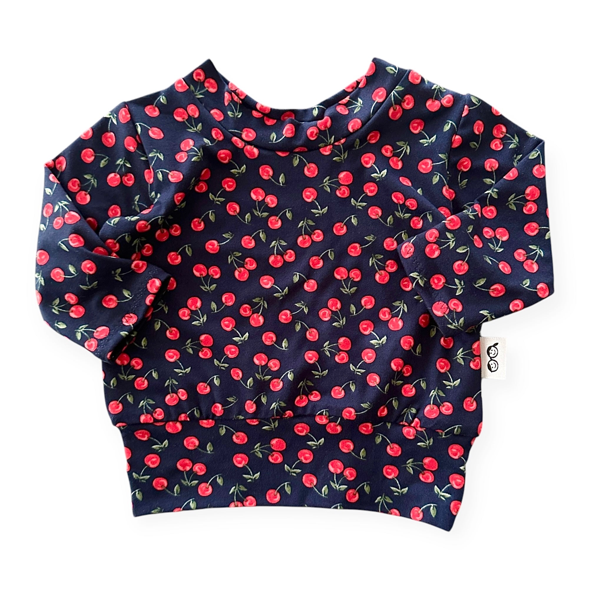 Cute and comfy baby sweatshirt – Midnight Cherries pullover with a stretchy neckline and relaxed fit. Handmade for stylish newborns and toddlers.