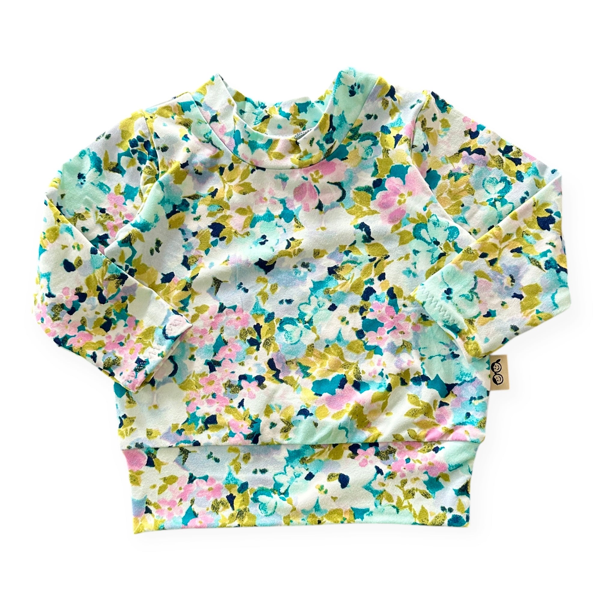 Floral patterned baby top on a white background