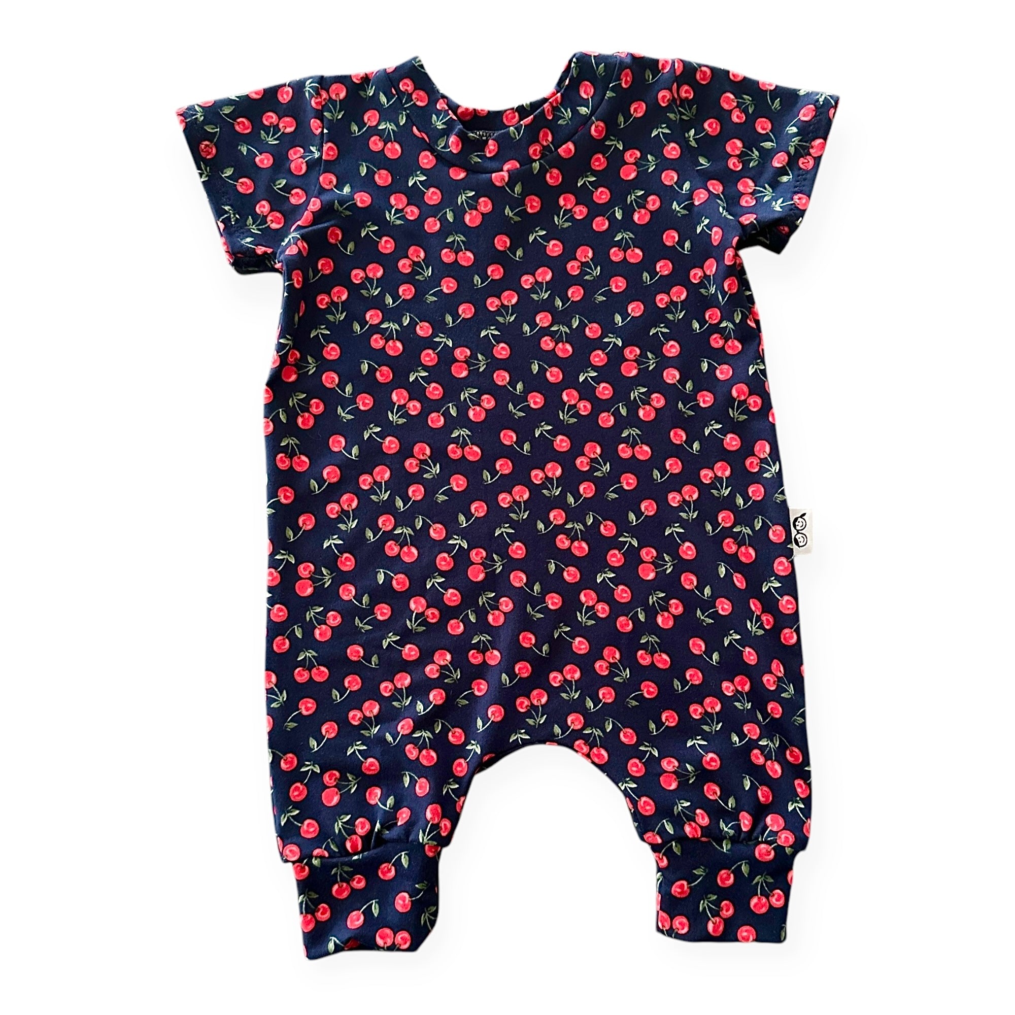 Midnight Cherries baby romper – soft and stretchy cherry print romper for babies and toddlers. Handmade, comfortable, and perfect for everyday wear.