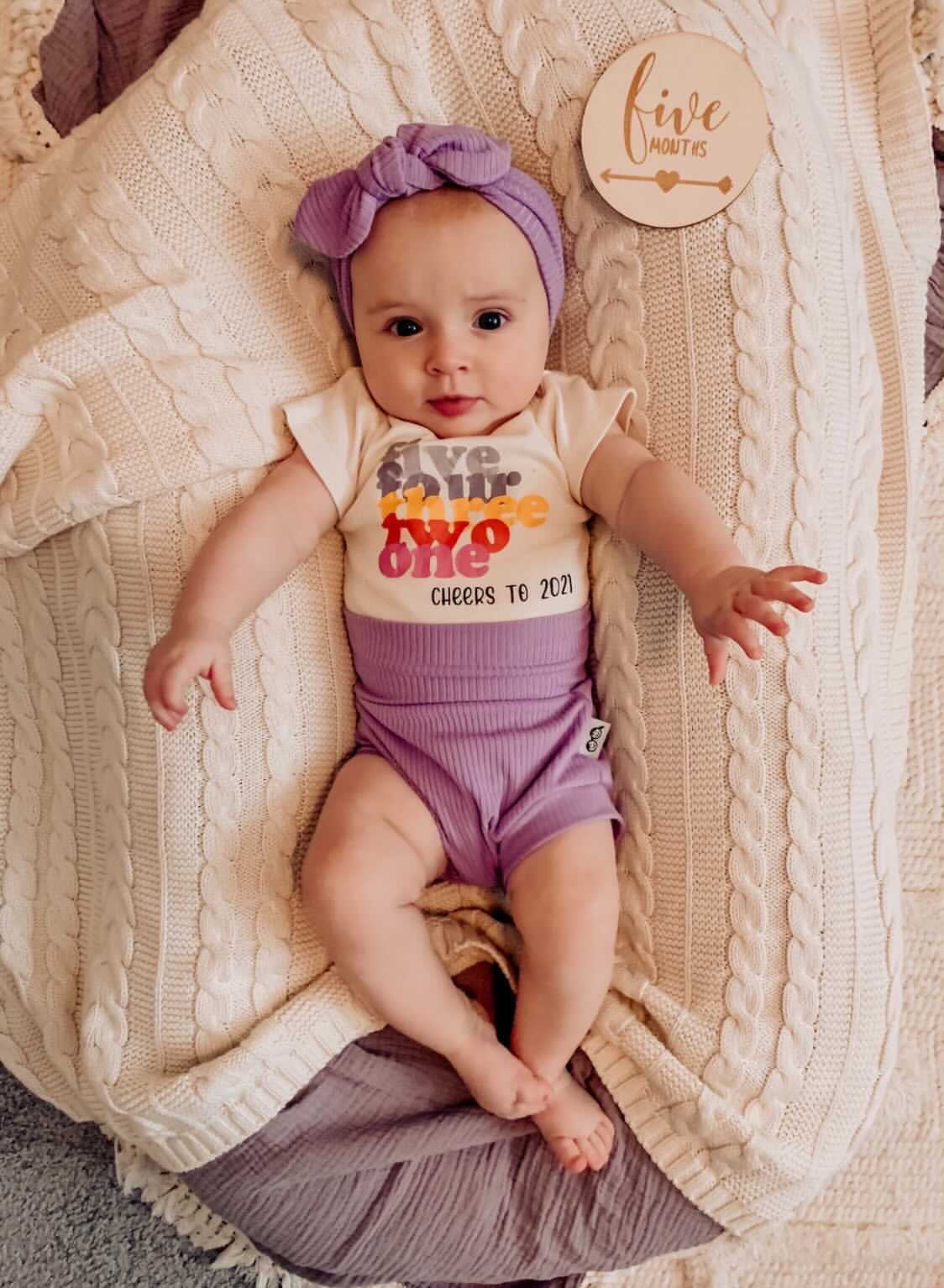 Baby Girl in Lavender Ribbed Bummies 