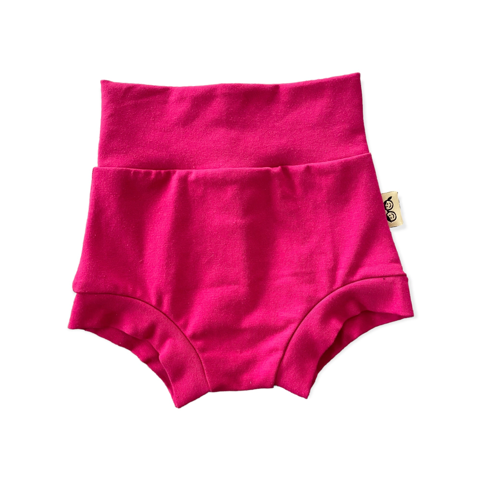 Handmade hot pink baby bummies with a fold-over waistband, displayed flat on a white background. Soft, stretchy, and comfortable for newborns, infants, and toddlers. Perfect for warm weather, layering over diapers, or pairing with bodysuits and tops. Available in sizes preemie to 4T.