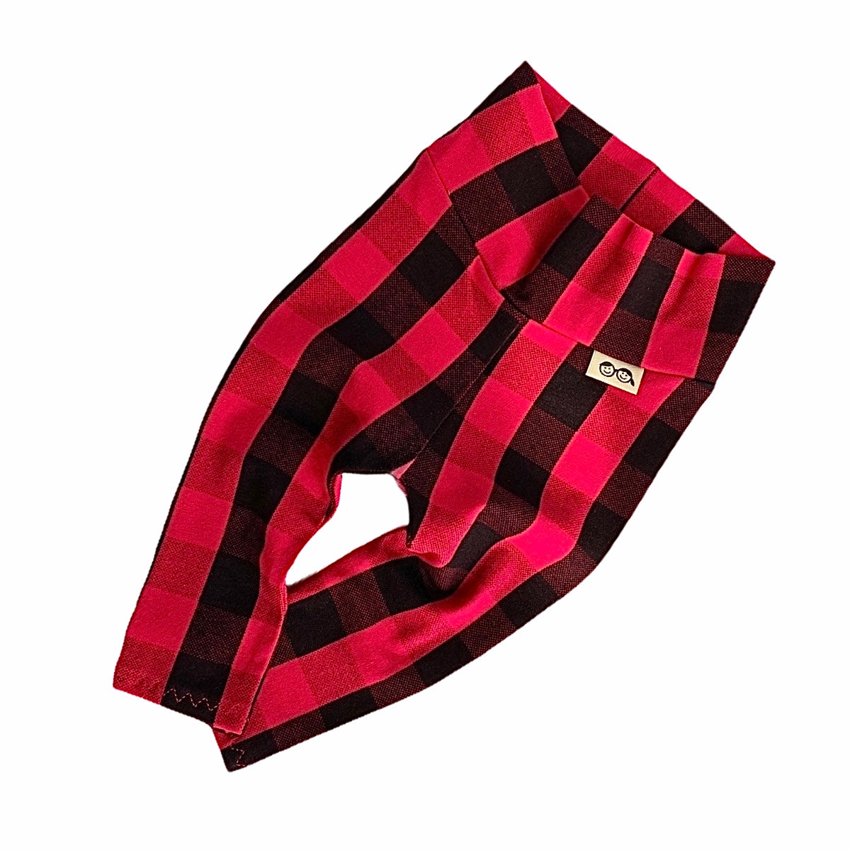 Handmade red buffalo plaid baby leggings, unisex holiday pants perfect for cozy and stylish winter outfits.