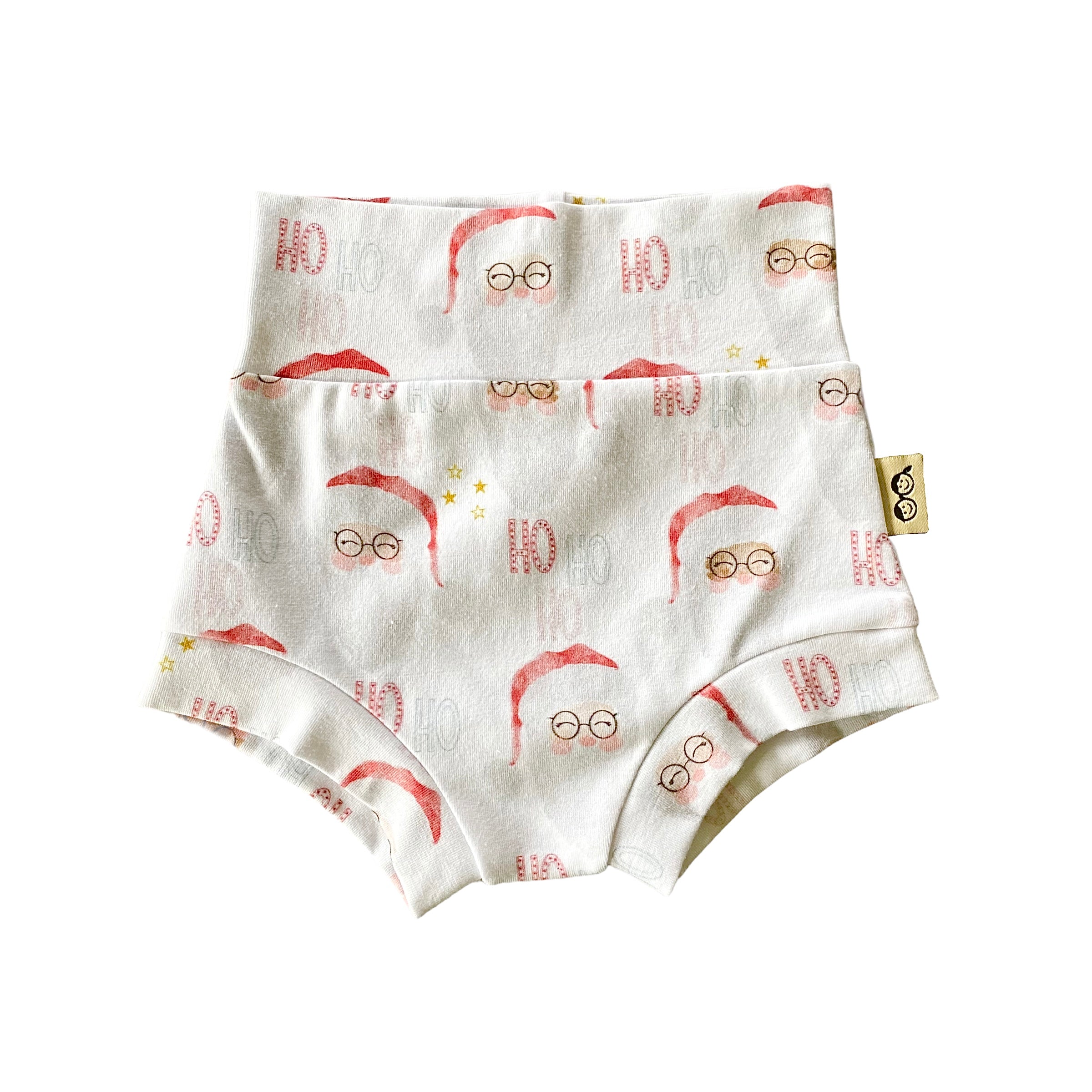 Vintage Santa bummies with a high-waisted design, featuring a festive red and white Santa Claus print. Handmade diaper cover for babies and toddlers, perfect for holiday celebrations and seasonal outfits.