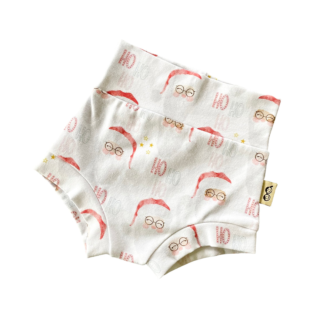 Vintage Santa bummies with a high-waisted design, featuring a festive red and white Santa Claus print. Handmade diaper cover for babies and toddlers, perfect for holiday celebrations and seasonal outfits.