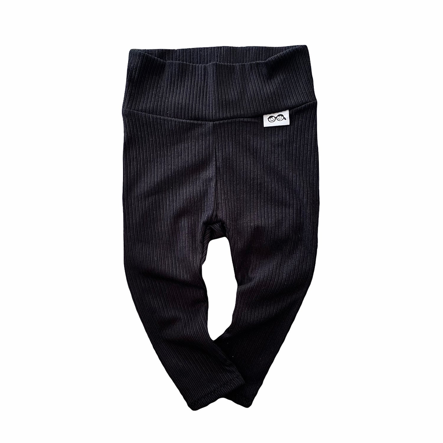 Baby black ribbed leggings – soft, stretchy, and cozy for newborns, infants, and toddlers. Perfect for everyday wear, these gender-neutral pants offer comfort and style. Handmade with love, available in sizes preemie to 4T. Ideal for layering with sweaters, onesies, or tees. A must-have for trendy baby outfits!