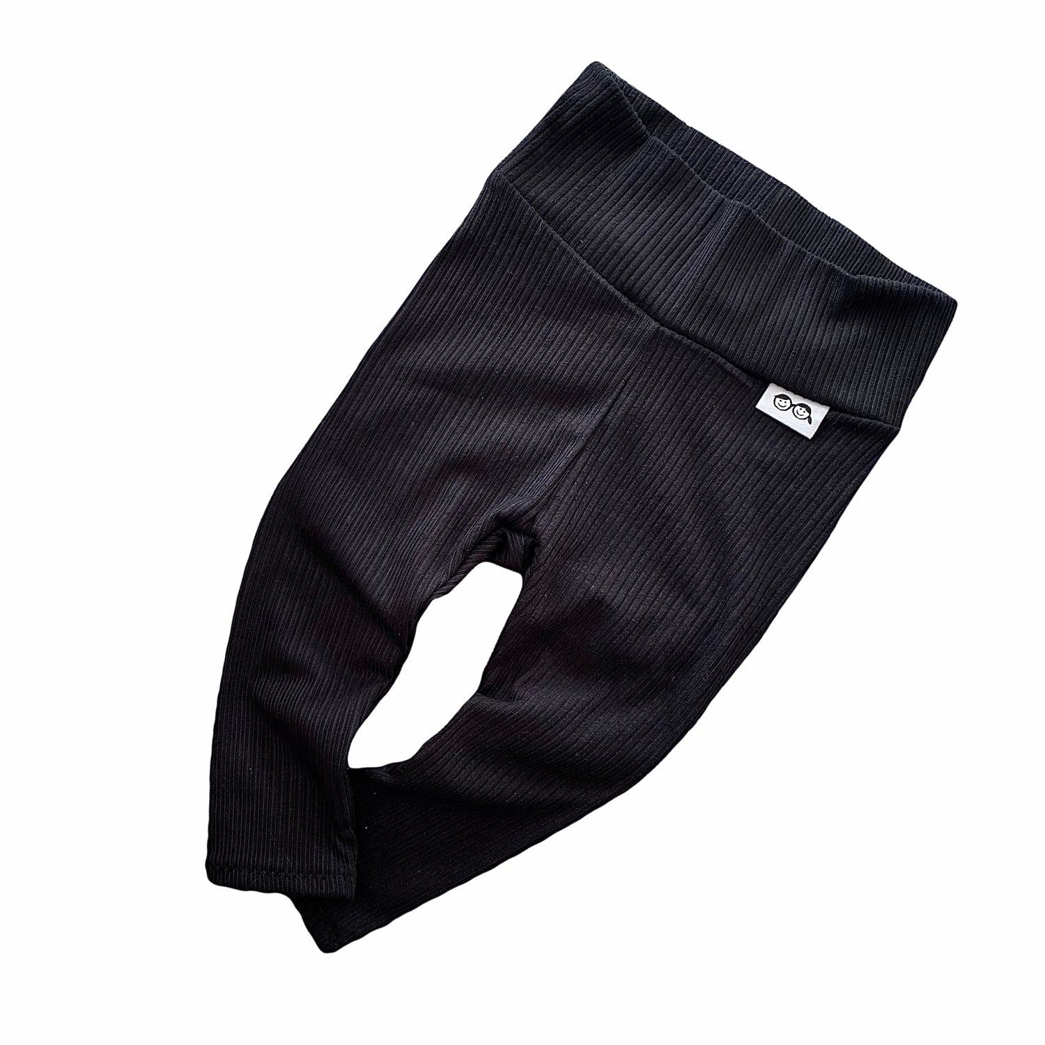 Baby black ribbed leggings – soft, stretchy, and cozy for newborns, infants, and toddlers. Perfect for everyday wear, these gender-neutral pants offer comfort and style. Handmade with love, available in sizes preemie to 4T. Ideal for layering with sweaters, onesies, or tees. A must-have for trendy baby outfits!