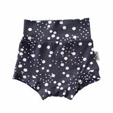 Handmade polka dot bummies for babies and toddlers, featuring a stylish black and white design. Soft, comfortable, and perfect as a diaper cover or for everyday wear. Ideal for active little ones and special occasions alike.