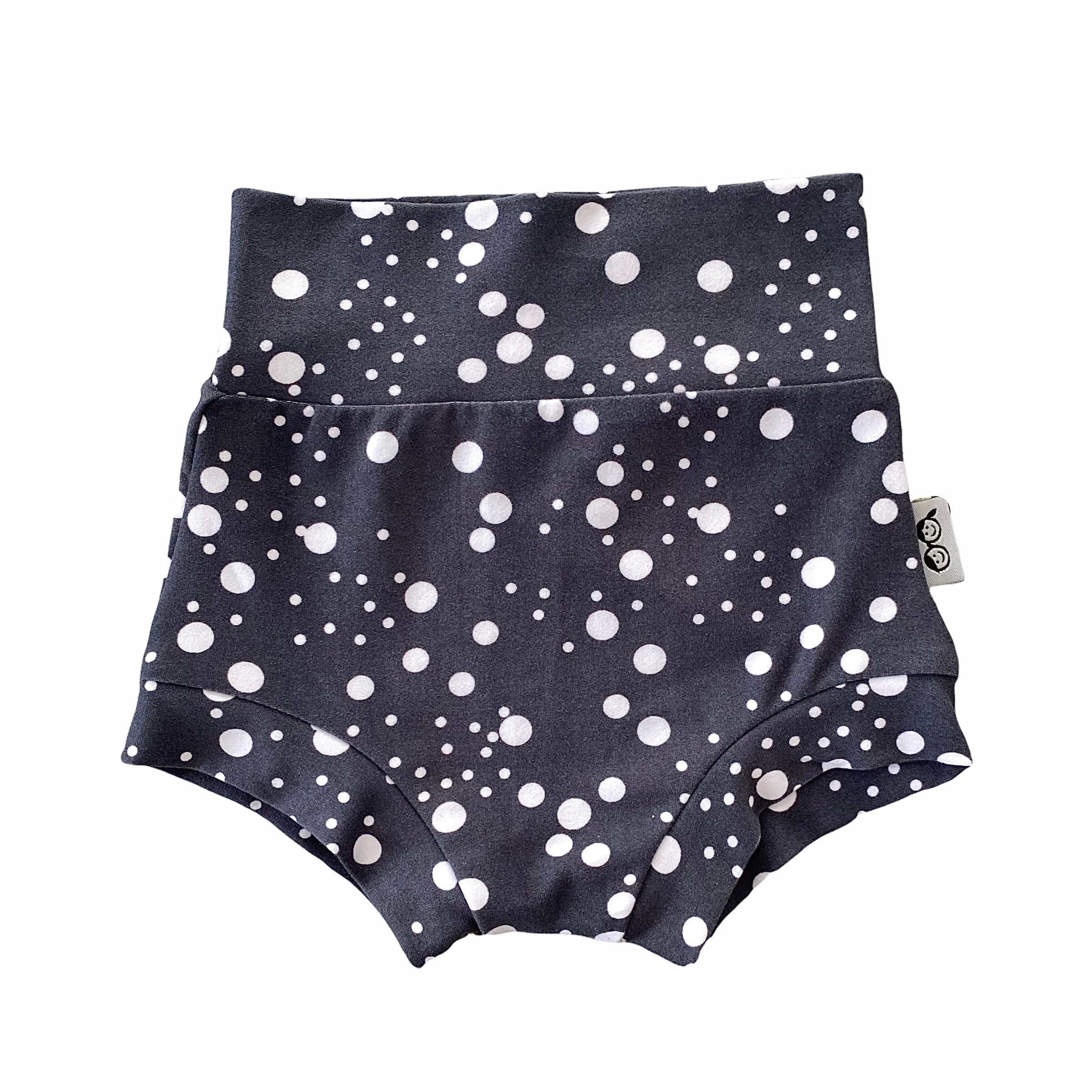 Handmade polka dot bummies for babies and toddlers, featuring a stylish black and white design. Soft, comfortable, and perfect as a diaper cover or for everyday wear. Ideal for active little ones and special occasions alike.