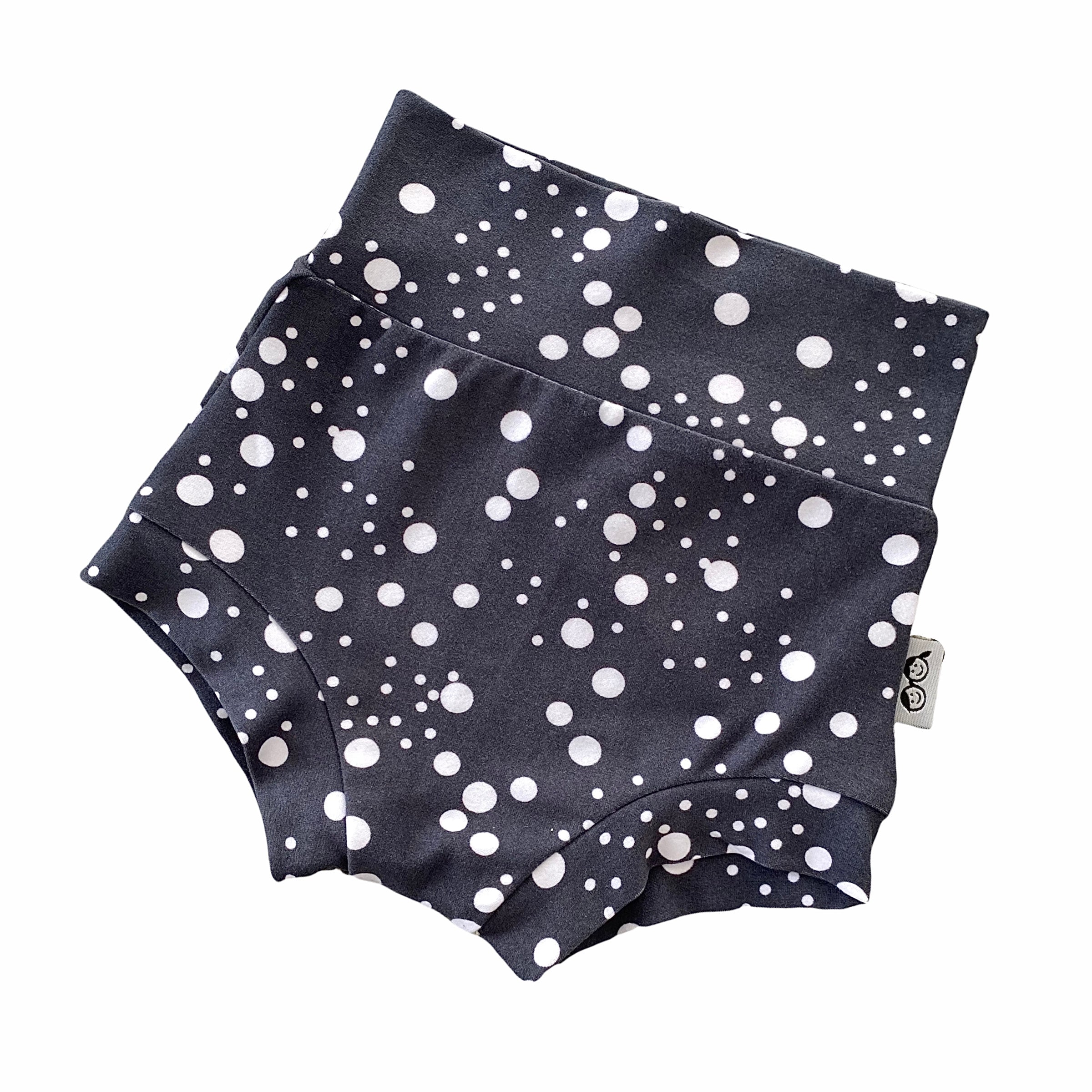 Handmade polka dot bummies for babies and toddlers, featuring a stylish black and white design. Soft, comfortable, and perfect as a diaper cover or for everyday wear. Ideal for active little ones and special occasions alike.