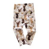 Handmade reindeer plaid lounge set for babies and toddlers, featuring a cozy long-sleeve top and matching leggings. Perfect holiday outfit.