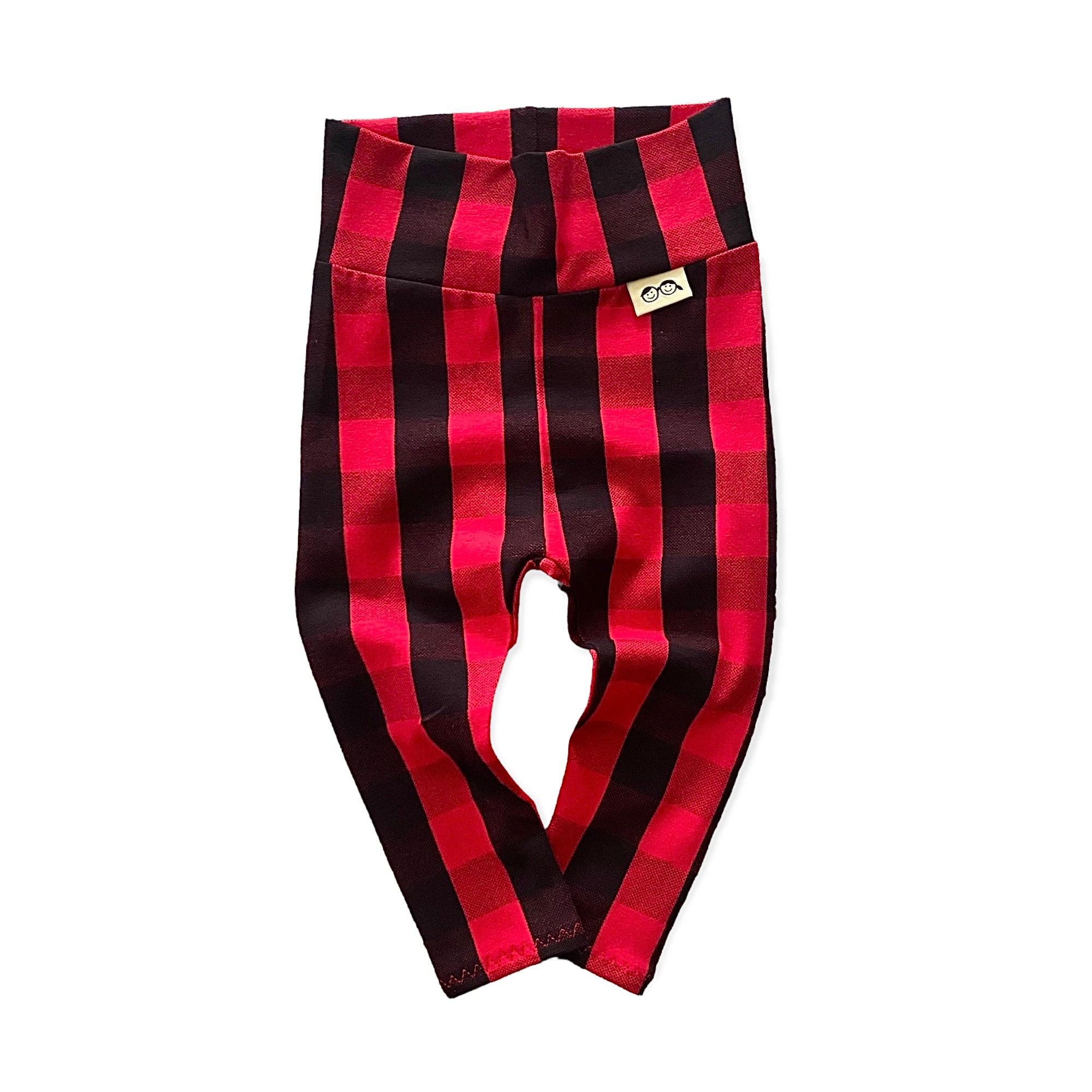 Cozy red buffalo plaid lounge set for kids, featuring a long-sleeve top and matching leggings, perfect for holiday style and comfort.