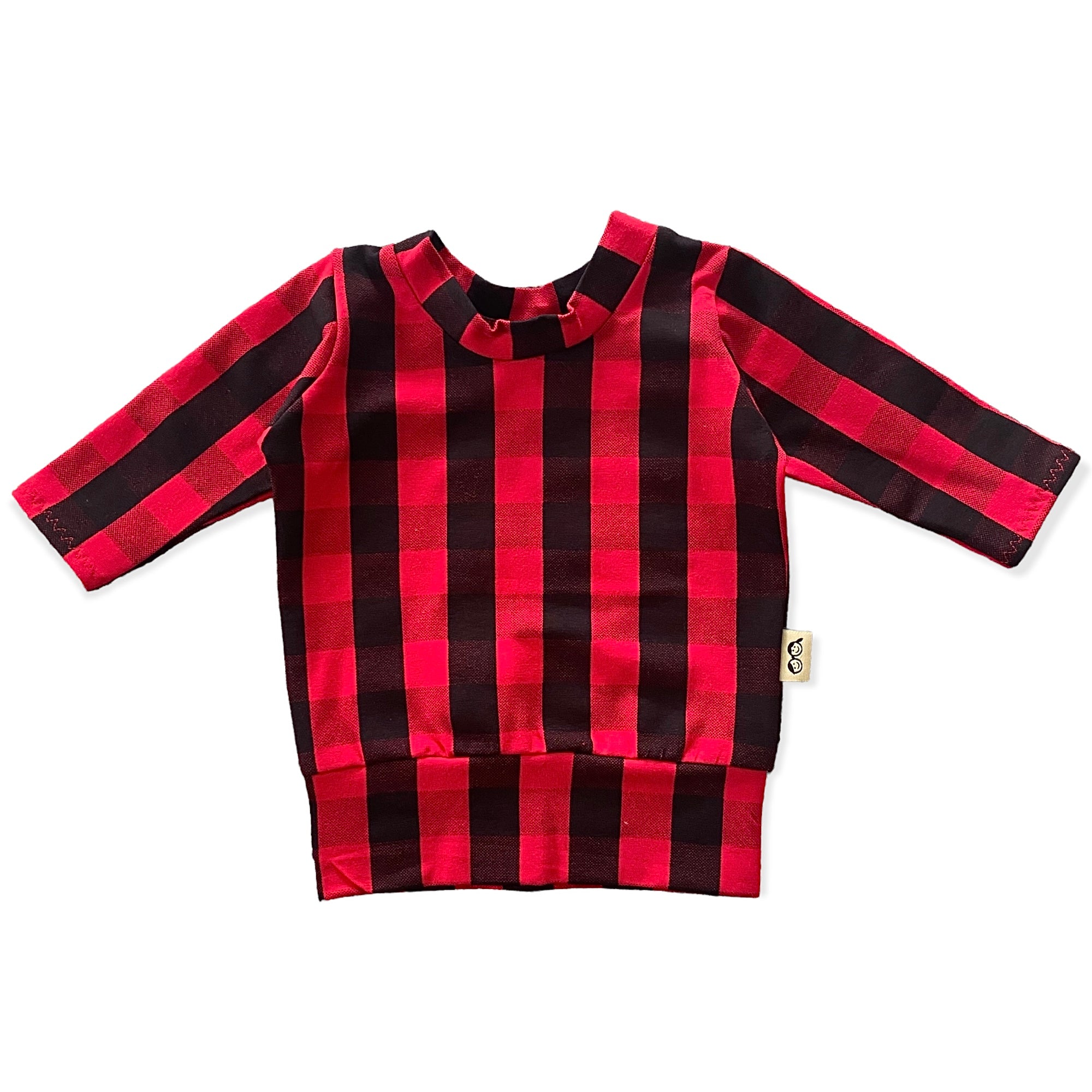 Cozy red buffalo plaid lounge set for kids, featuring a long-sleeve top and matching leggings, perfect for holiday style and comfort.