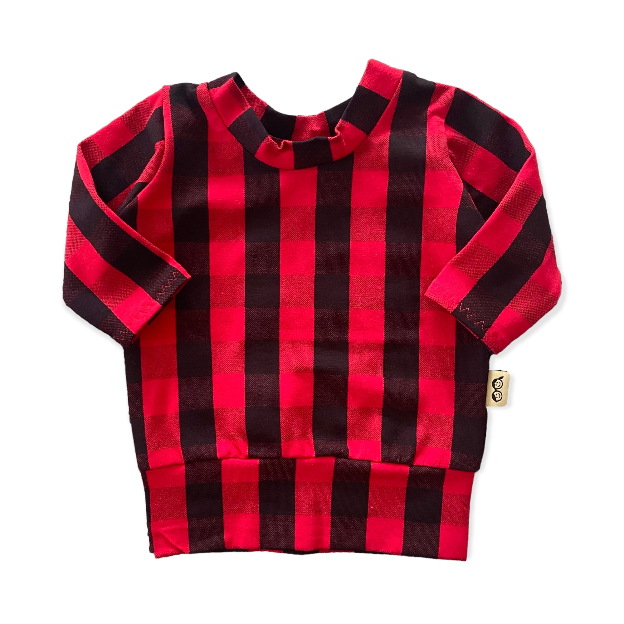 Cozy red buffalo plaid lounge set for kids, featuring a long-sleeve top and matching leggings, perfect for holiday style and comfort.