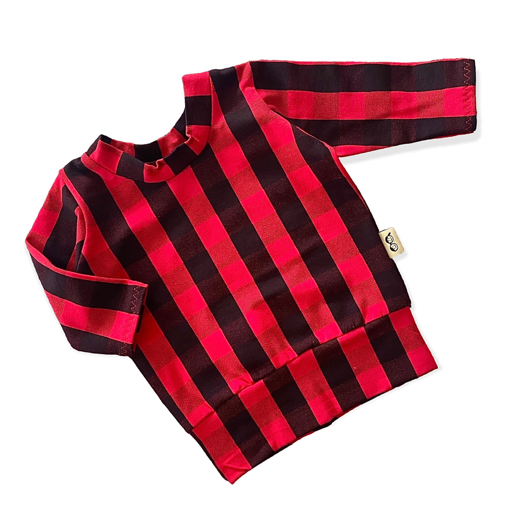 Cozy red buffalo plaid lounge set for kids, featuring a long-sleeve top and matching leggings, perfect for holiday style and comfort.