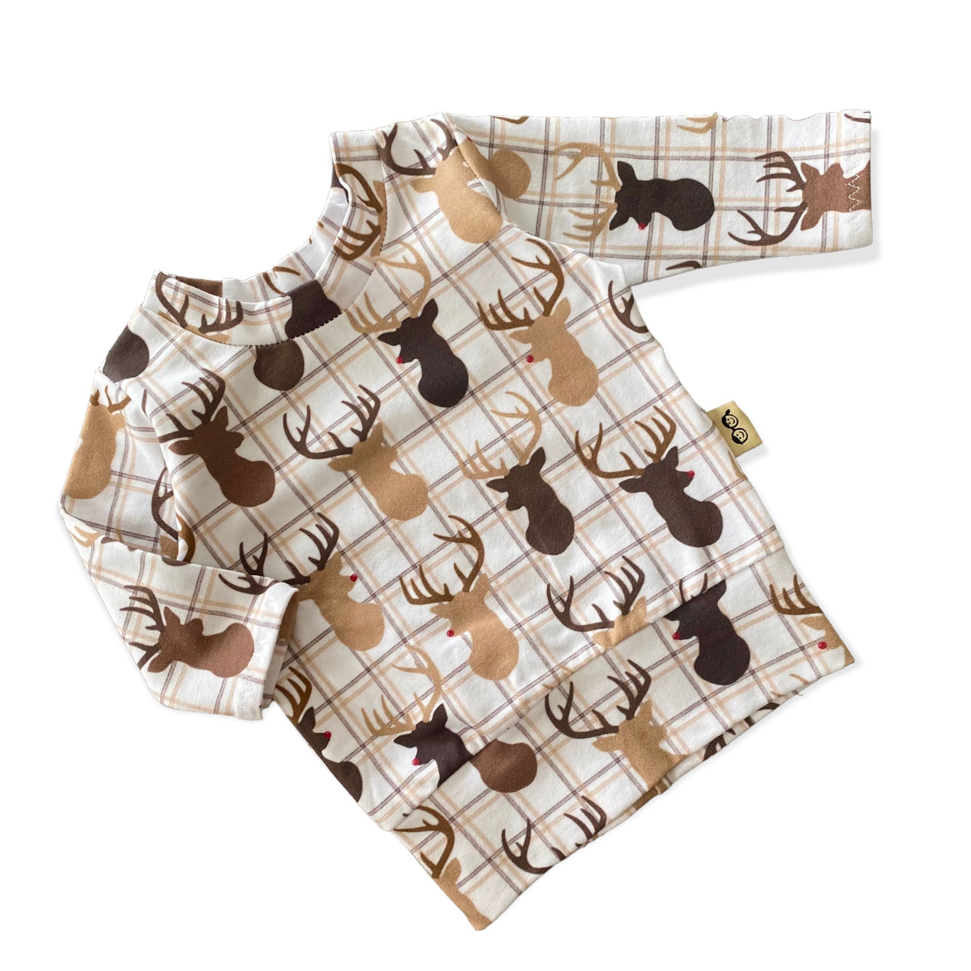 Handmade reindeer plaid long-sleeve top for babies and toddlers, featuring festive holiday designs in neutral tones. Cozy and stylish for winter.