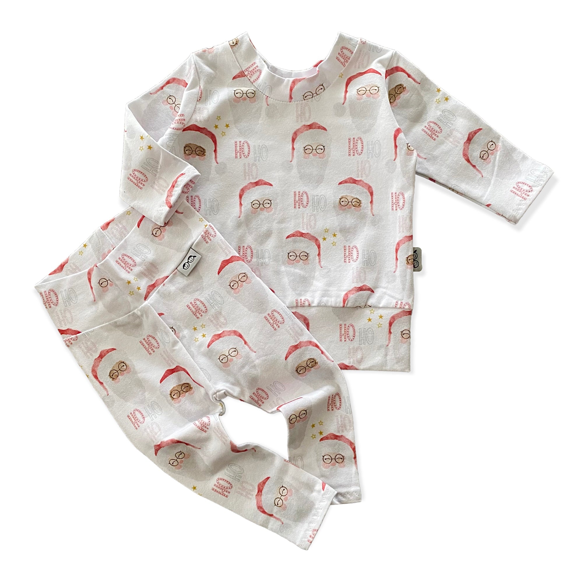 Vintage Santa Lounge Set featuring a festive Santa Claus print, includes a long-sleeve top and matching leggings. Handmade for babies and toddlers, perfect for holiday photos, Christmas morning, and seasonal celebrations.