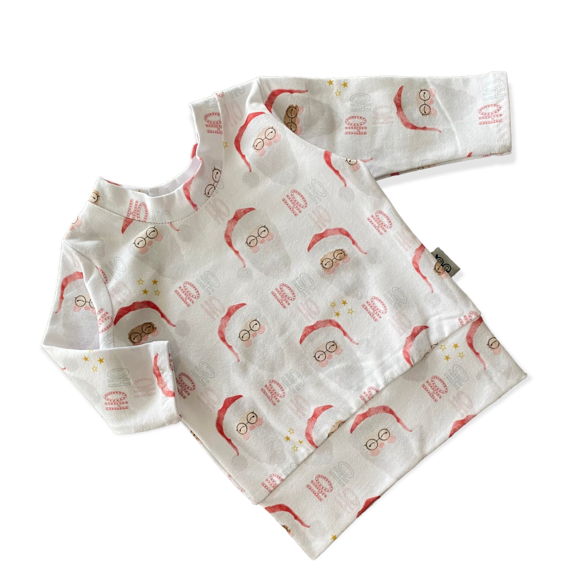Vintage Santa Lounge Set featuring a festive Santa Claus print, includes a long-sleeve top and matching leggings. Handmade for babies and toddlers, perfect for holiday photos, Christmas morning, and seasonal celebrations.