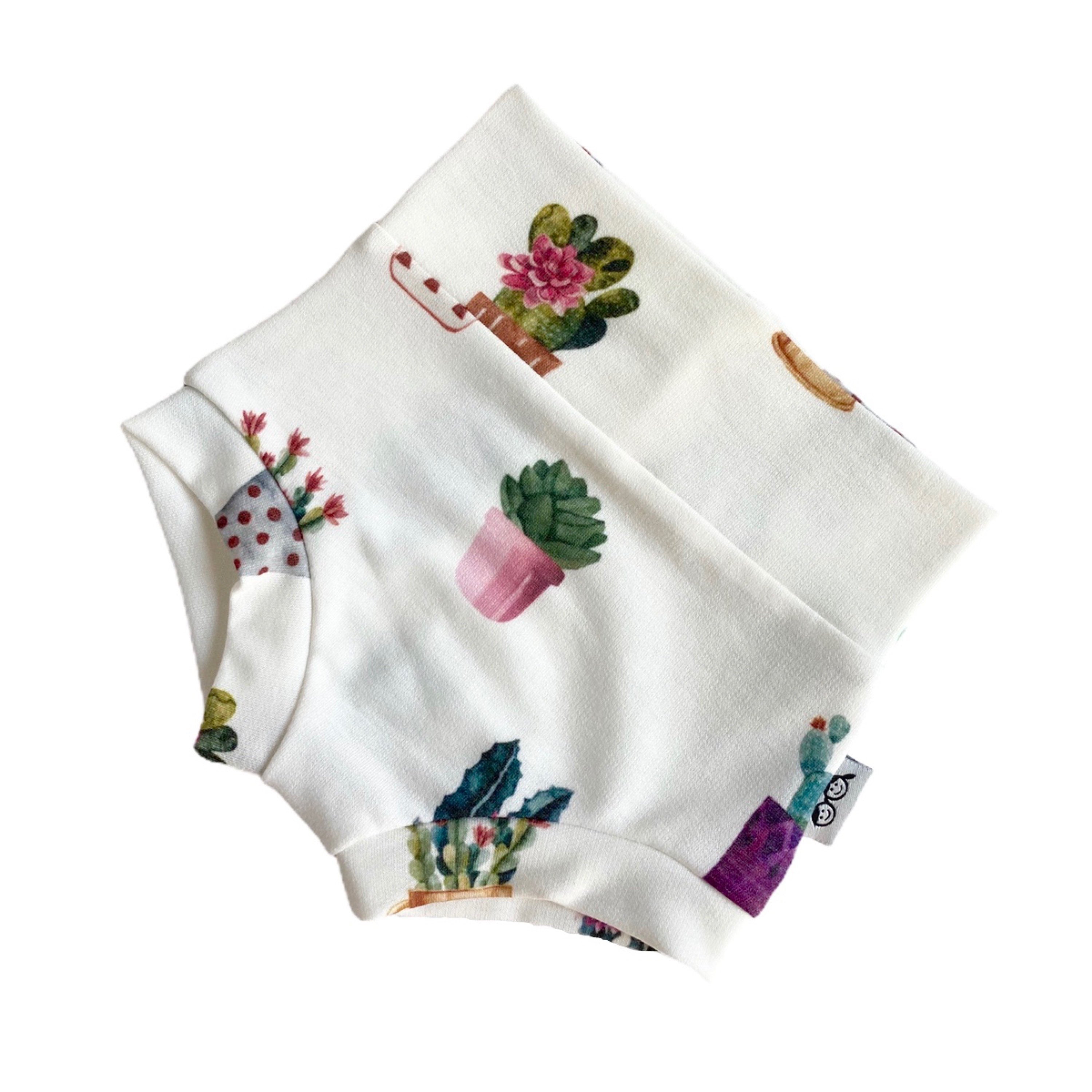Trendy baby bummies featuring a playful cactus print, perfect for every day wear.