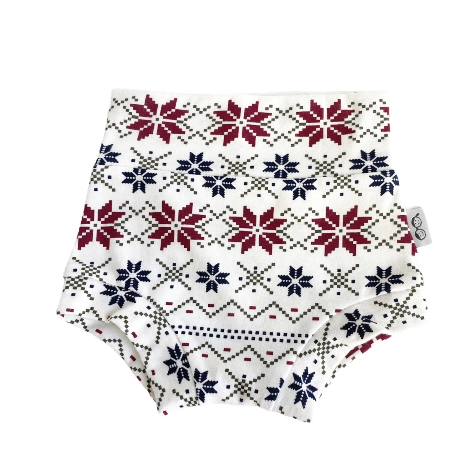 Handmade baby bummies with festive Nordic snowflake pattern in red, navy, and cream. Perfect diaper covers for holiday and winter outfits.