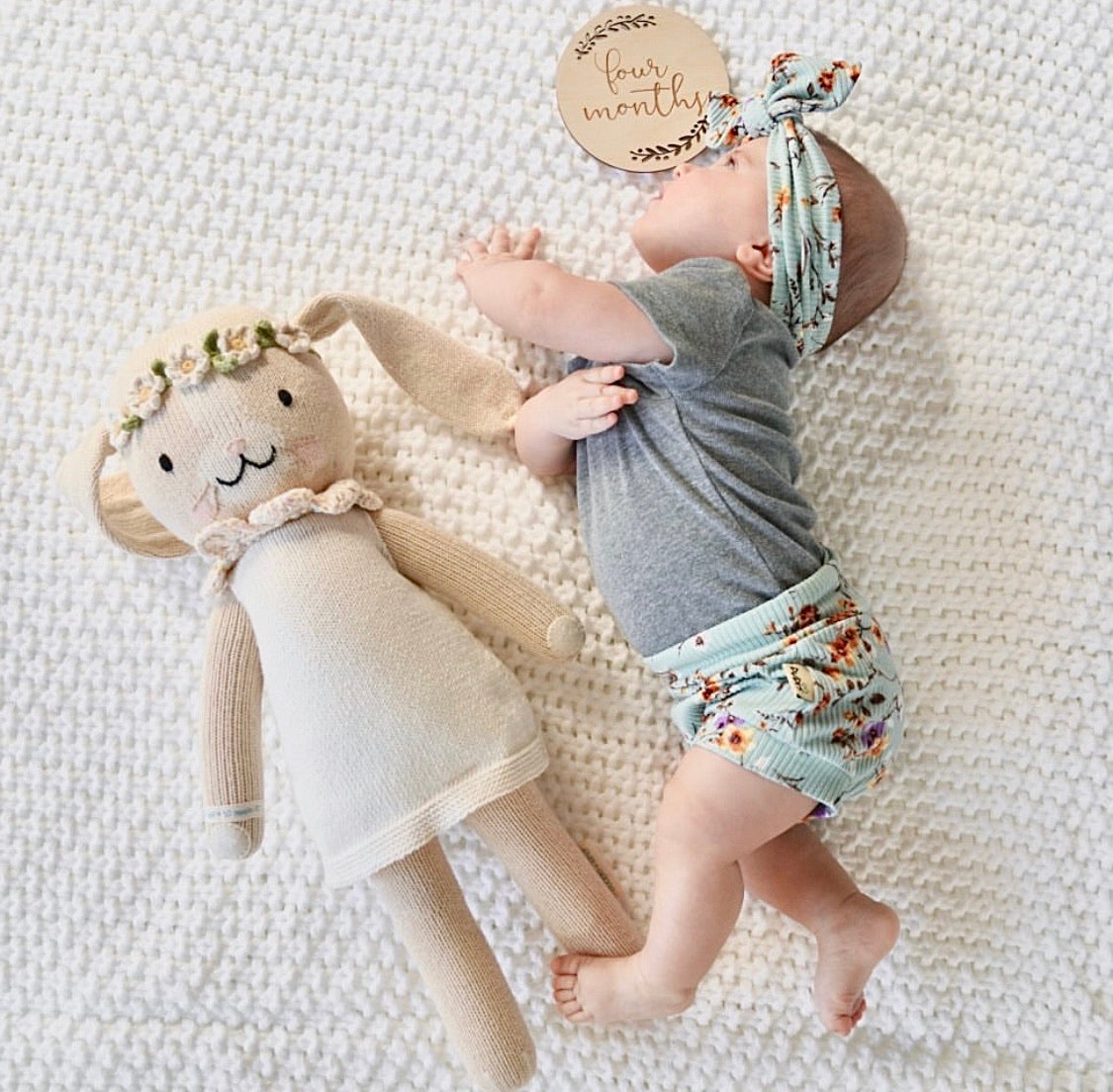 Baby Girl Wearing Dried Floral on Sage Ribbed Bummies