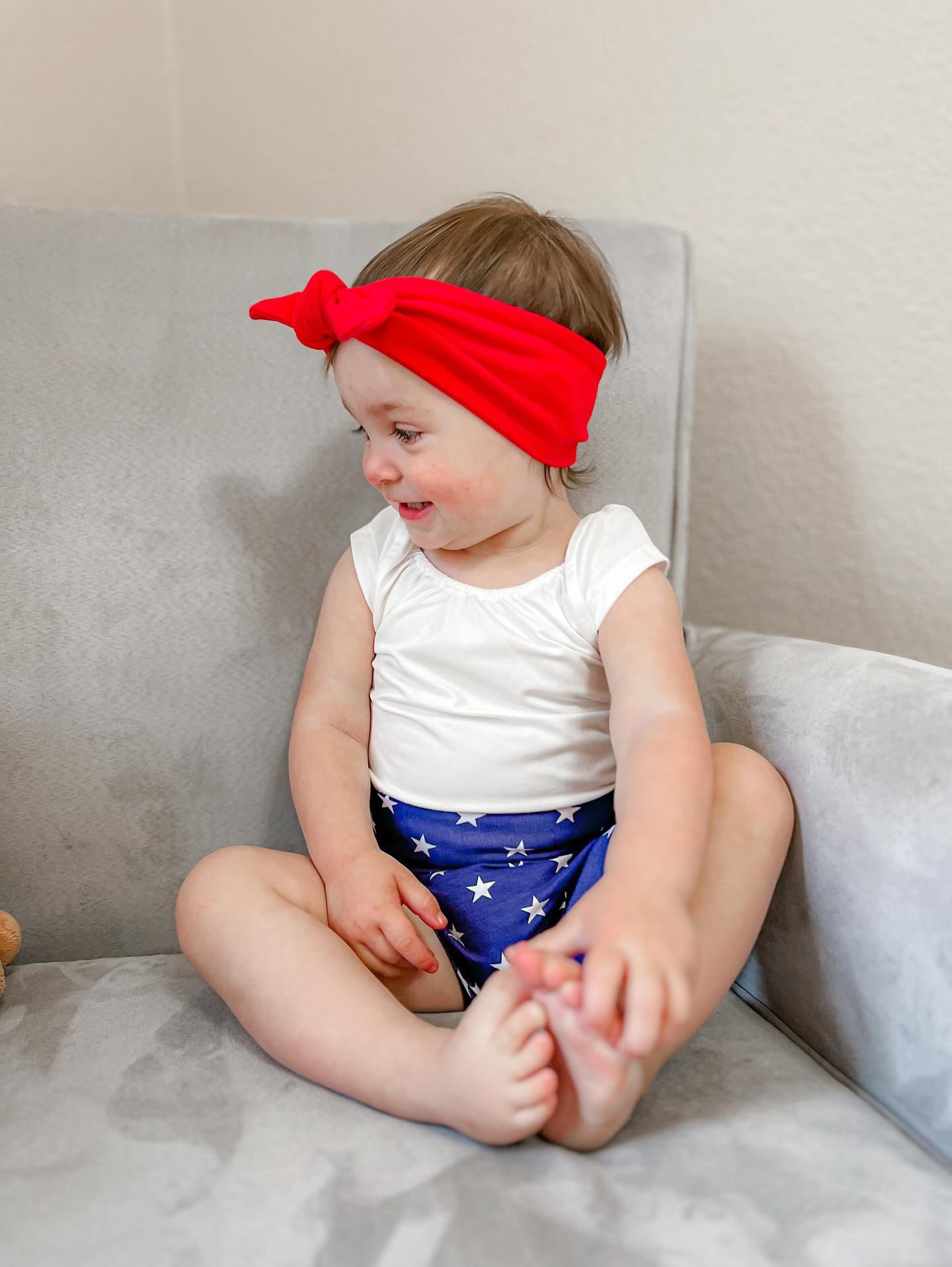 Baby Girl in Navy Stars Bummies with Red Headband