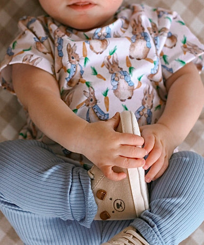 Comfortable baby lounge set featuring a vintage bunny print top and blue ribbed leggings. Soft, stretchy, and breathable fabric makes this a perfect everyday outfit for little ones. Great for Easter outfits, playtime, and baby photo sessions.