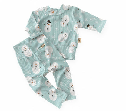 Mint snowman winter lounge set with long-sleeve top and leggings in soft ribbed knit — handmade baby and toddler Christmas outfit.