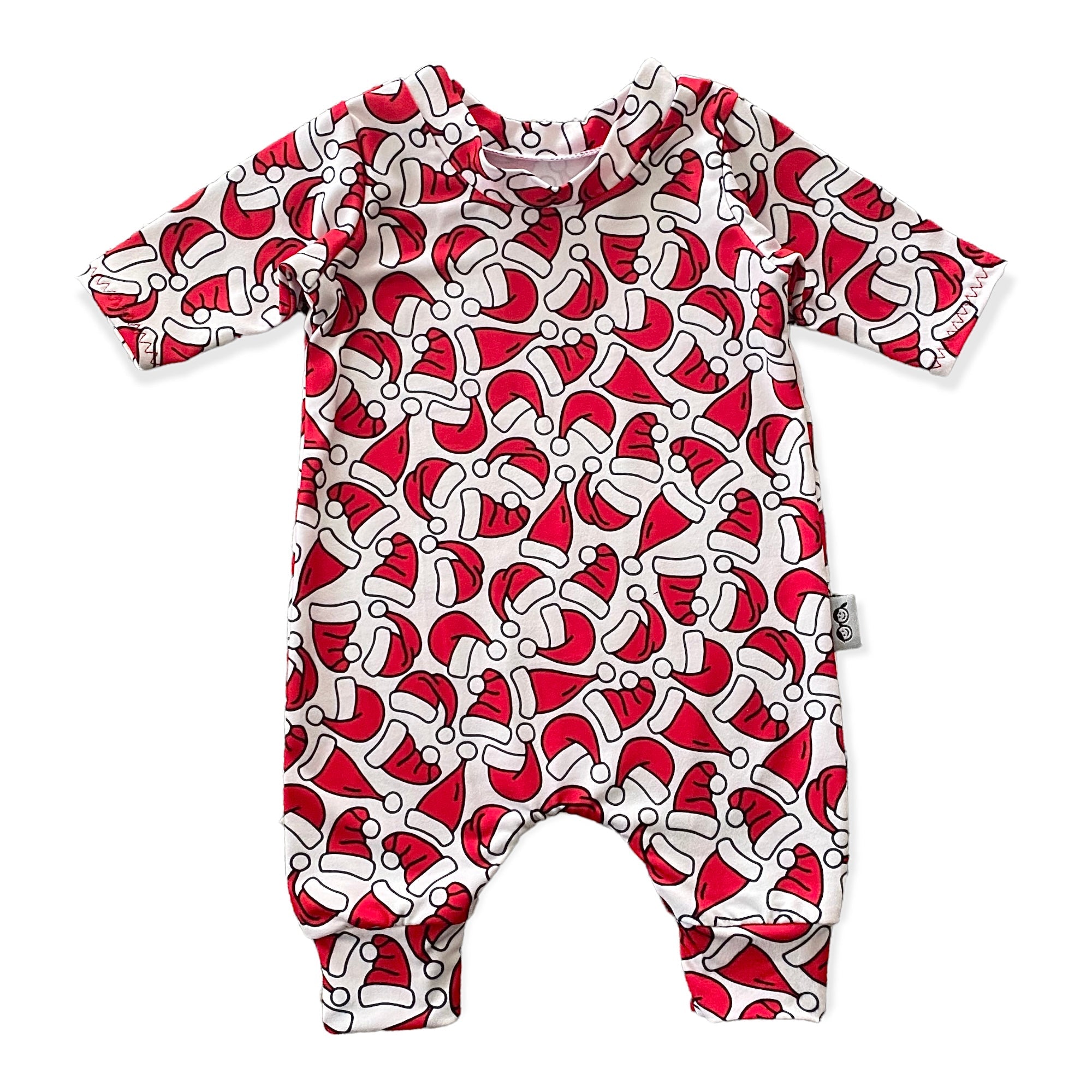 Festive baby romper with vibrant red and white Santa hat print, perfect for holiday celebrations. Available in sizes newborn to 4T.