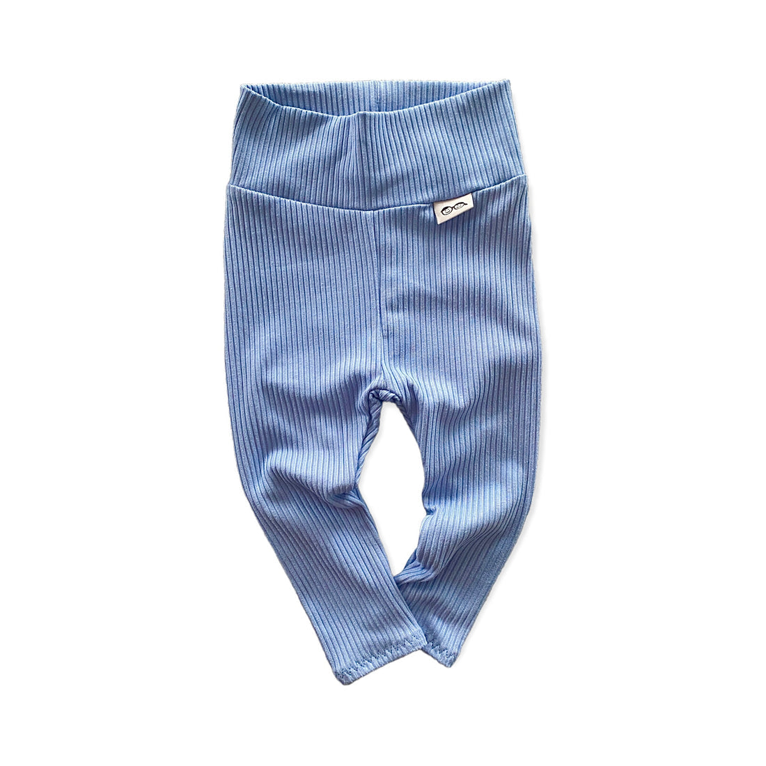 Soft and stretchy blue ribbed baby leggings with a fold-over waistband. Designed for comfort and movement, perfect for newborns to toddlers. A gender-neutral essential for layering with tops, onesies, or seasonal outfits. Available in sizes preemie to 4T.