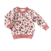 Blush leopard baby sweatshirt with mauve and pink spots and matching ribbed cuffs, handmade cozy long sleeve top for toddlers.