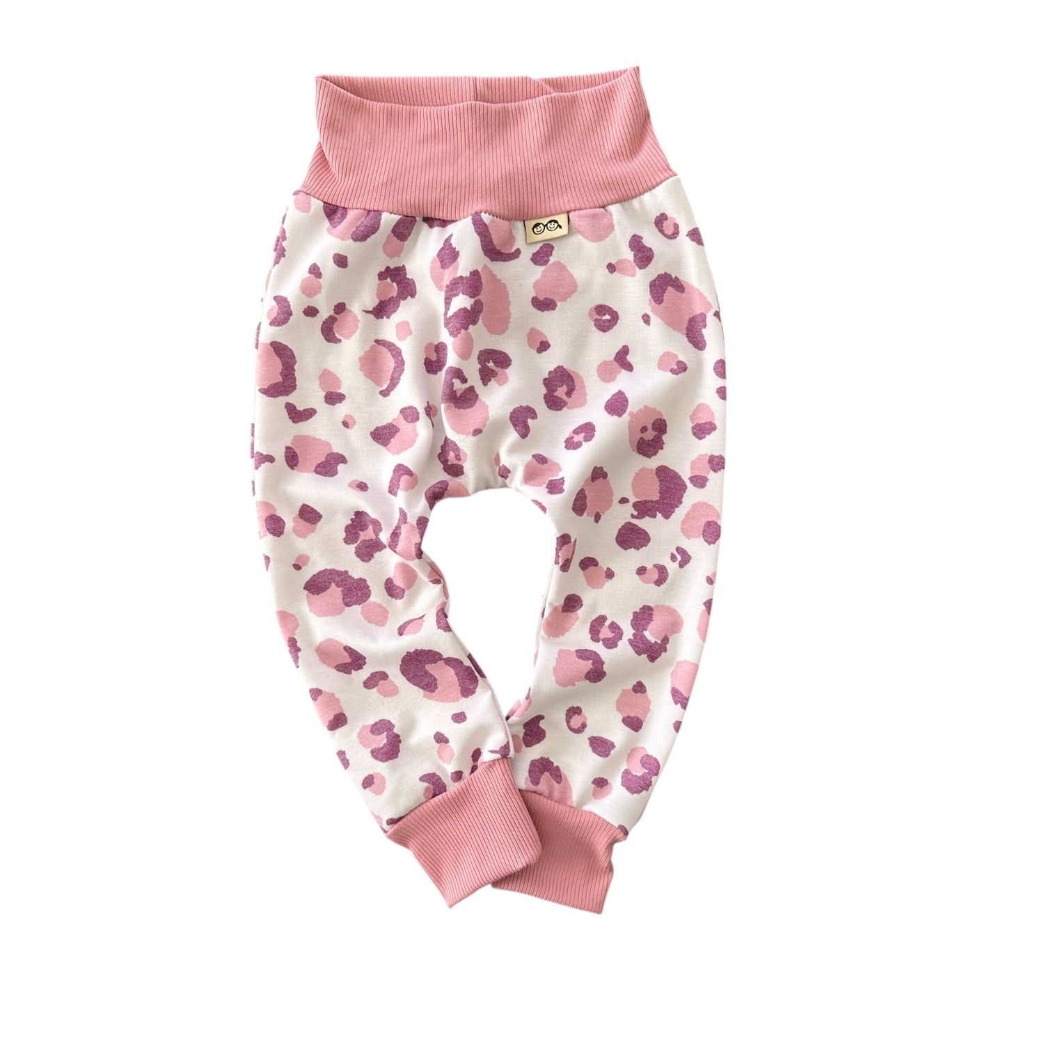 Baby harem pants in blush and mauve leopard print with soft pink stretch waistband and cuffs, handmade cozy baby clothing.