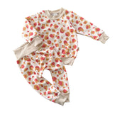 Cream baby lounge set with coral and mustard leopard spots, long-sleeve sweatshirt and harem pants, handmade toddler outfit.