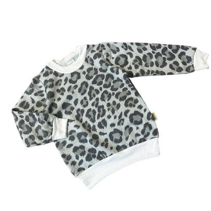 Grey leopard print baby sweatshirt with white ribbed collar and cuffs, cozy long sleeve top for babies and toddlers.