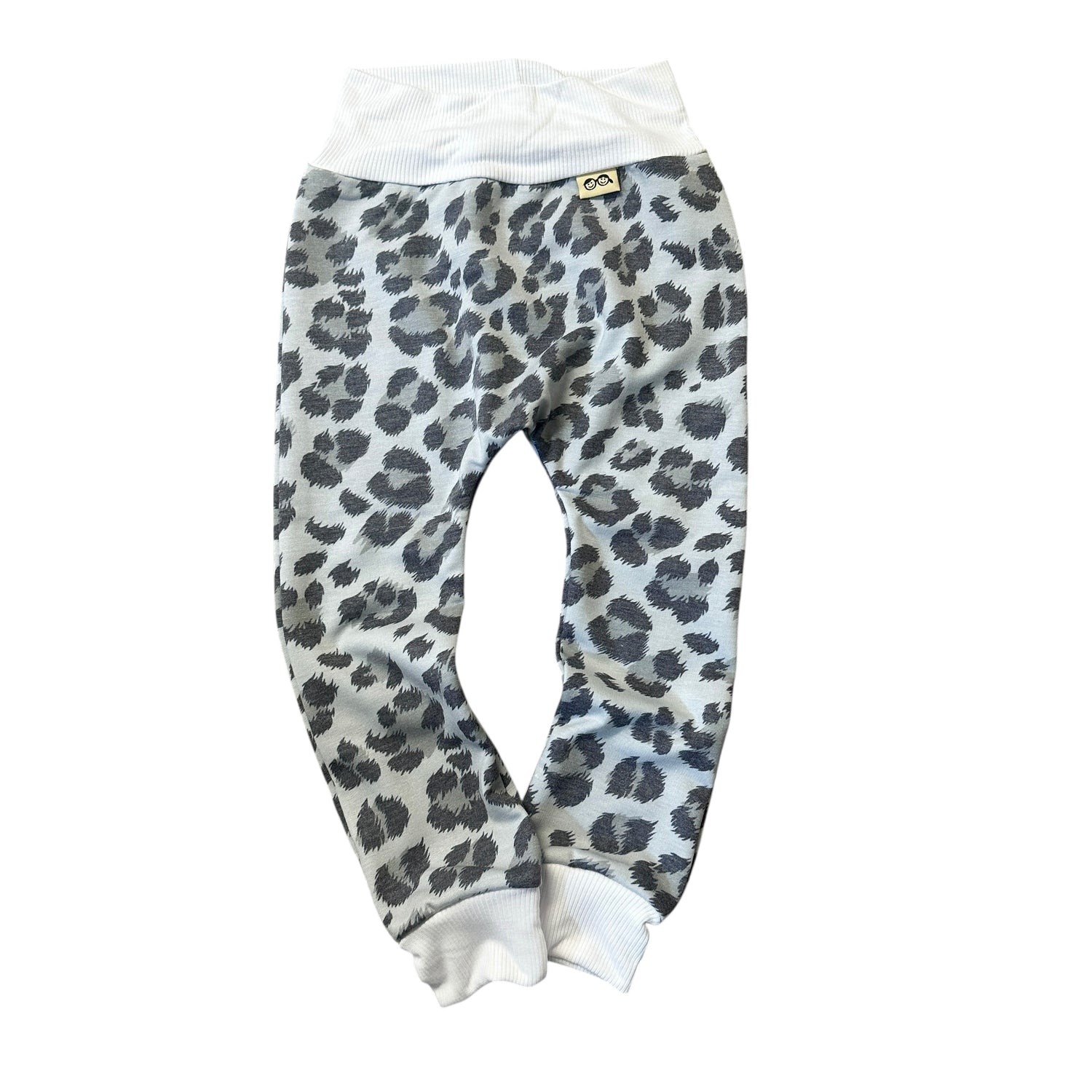 Grey leopard baby harem pants with white ribbed waistband and cuffs, handmade neutral baby clothing.