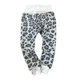 Grey leopard baby harem pants with white ribbed waistband and cuffs, handmade neutral baby clothing.