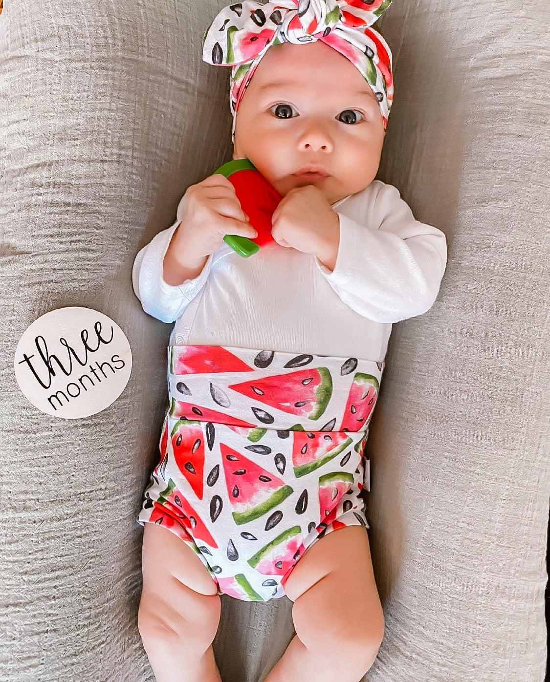 Baby wearing Watermelon Bummies 