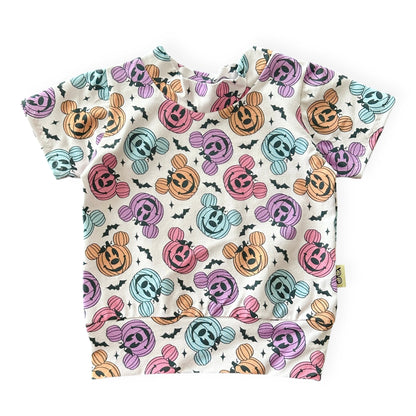Baby t-shirt with Halloween-themed pattern on a white background