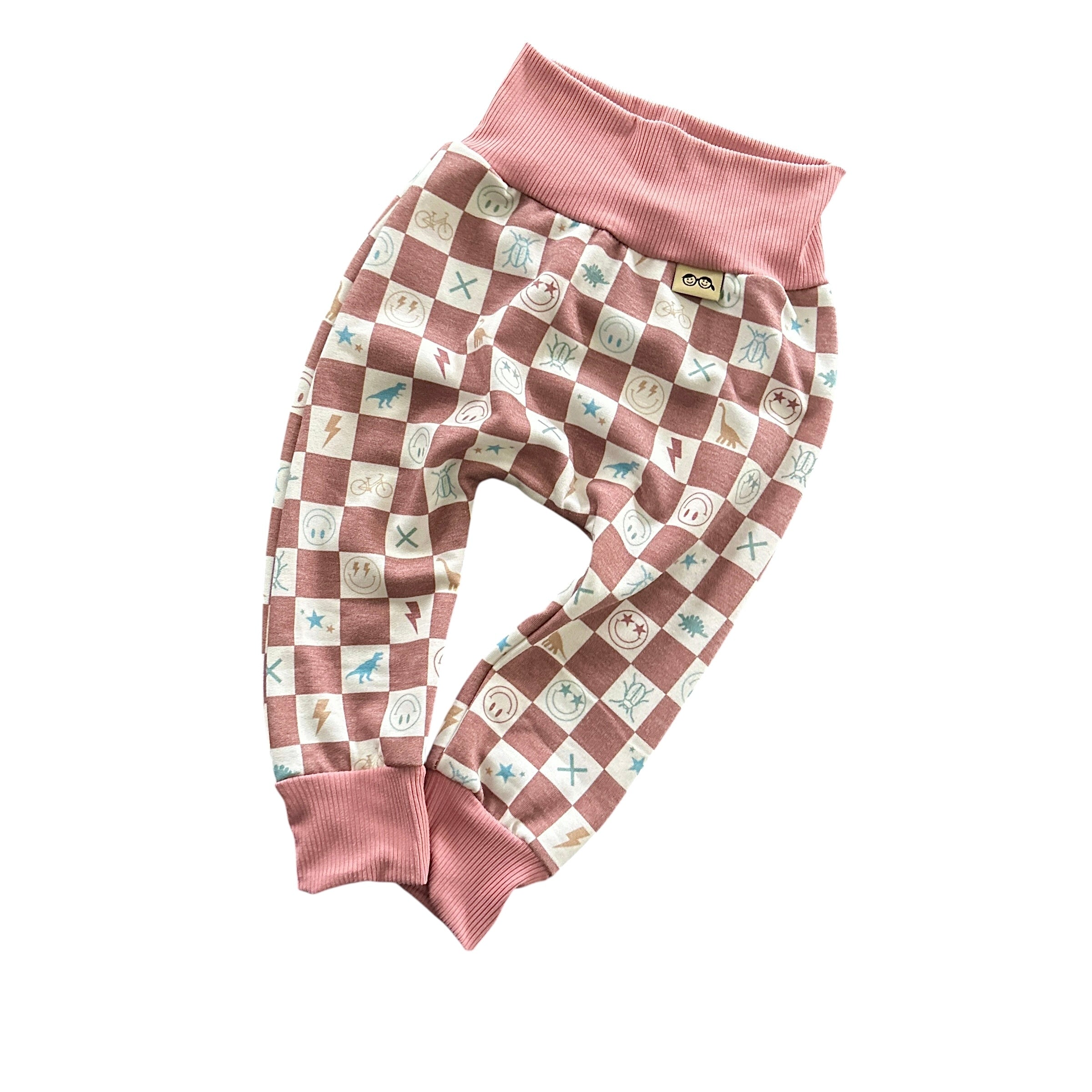 Mauve checker smiley icons baby lounge pants with soft ribbed waistband and cuffs.