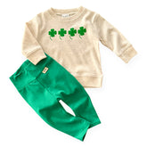 Neutral cream shamrock pullover paired with green baby leggings – a perfect St. Patrick’s Day outfit for newborns, infants, and toddlers. Soft, cozy, and festive, this lucky clover sweatshirt and stretchy pants set is ideal for boys and girls. Sizes preemie to 4T available.