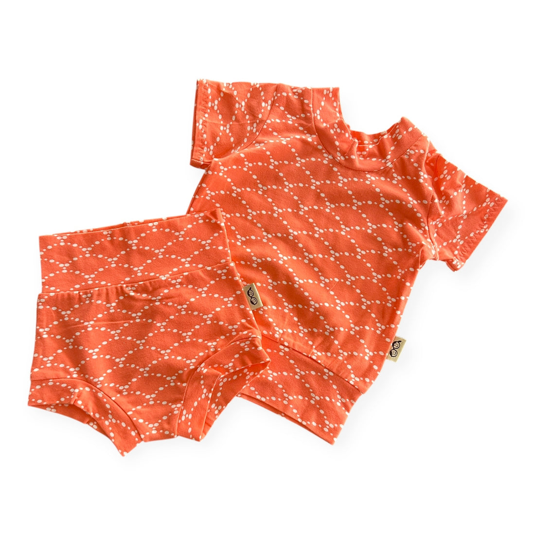 Handmade orange baby summer lounge set with white dotted pattern, includes short sleeve top and bummies