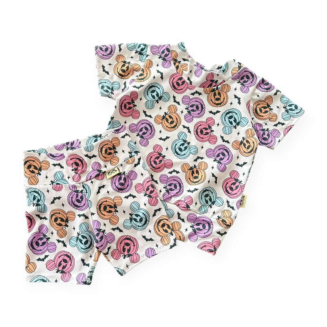 Set  of short sleeve top and shorts with colorful pumpkin  pattern on a white background