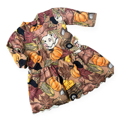 Handmade baby and toddler fall dress with scarecrow, pumpkins, corn, and autumn leaves pattern – Harvest Scarecrow print by Dudis Design